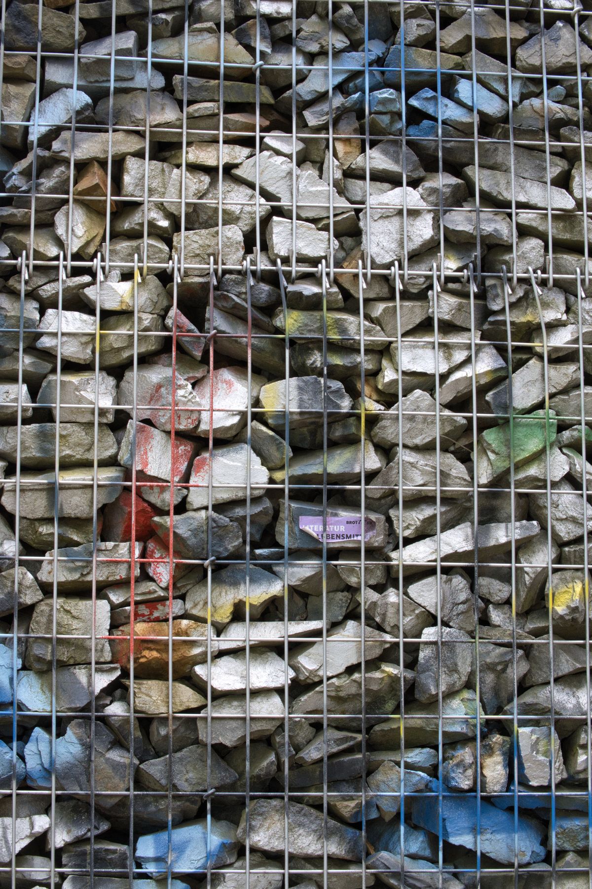 Gabion basket with painted stones for decorative landscaping