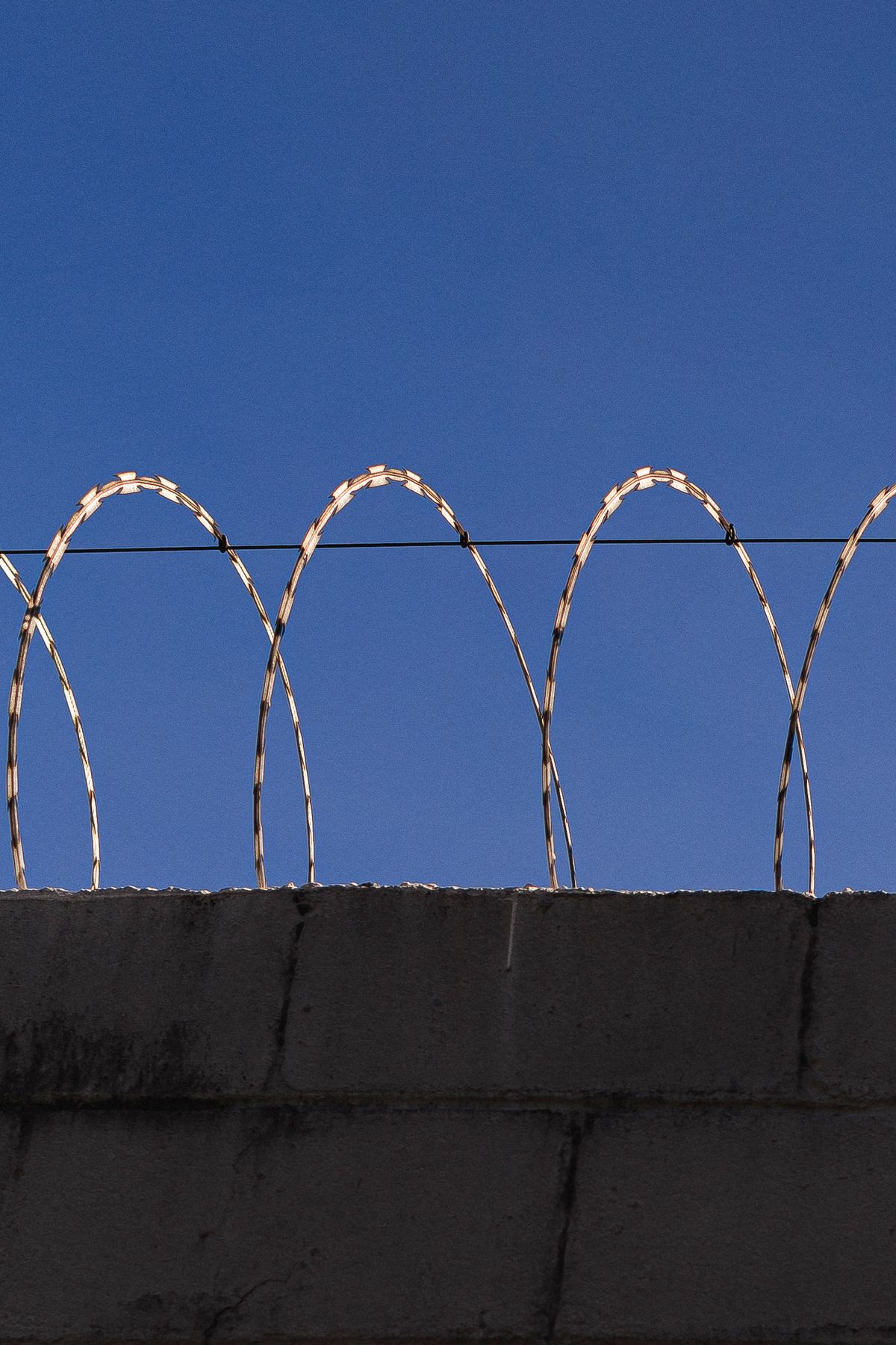 Razor wire on concrete wall for high security perimeter